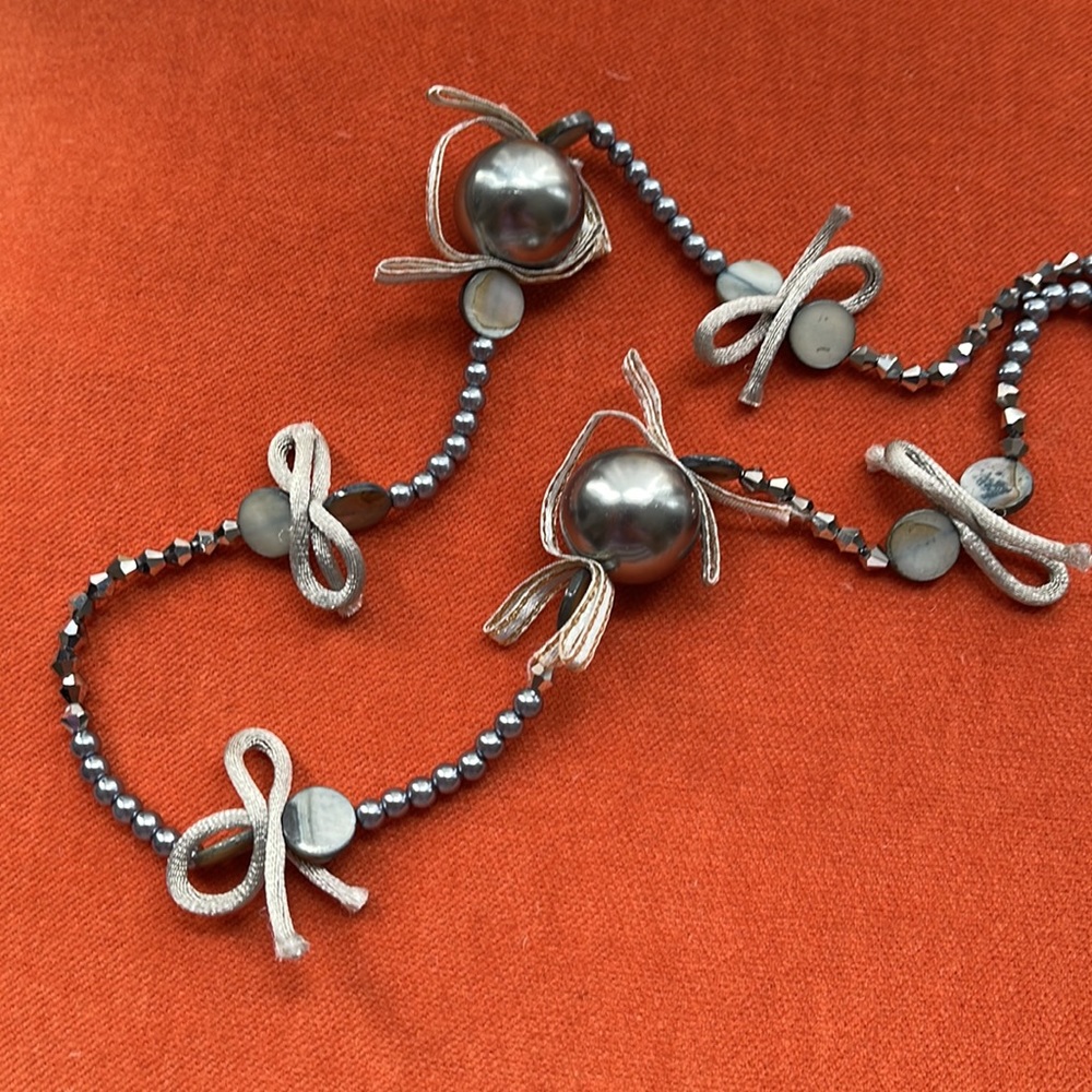 CHICO’s 32” long double-strand grey fashion necklace. Beads, crystals & bows.